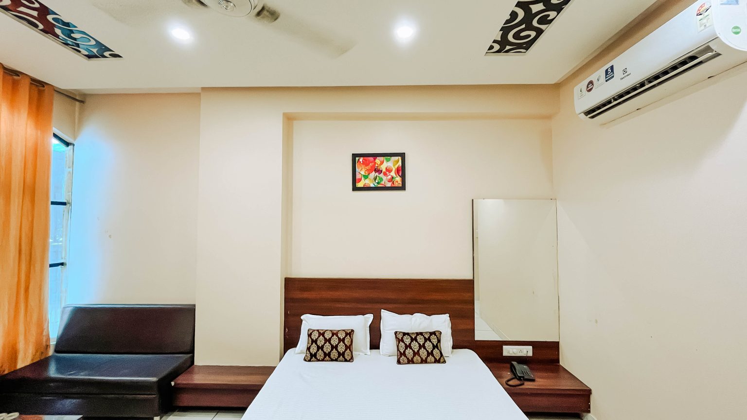 A premium deluxe room in Best hotel in ujjain - Nakshatra inn. Book now