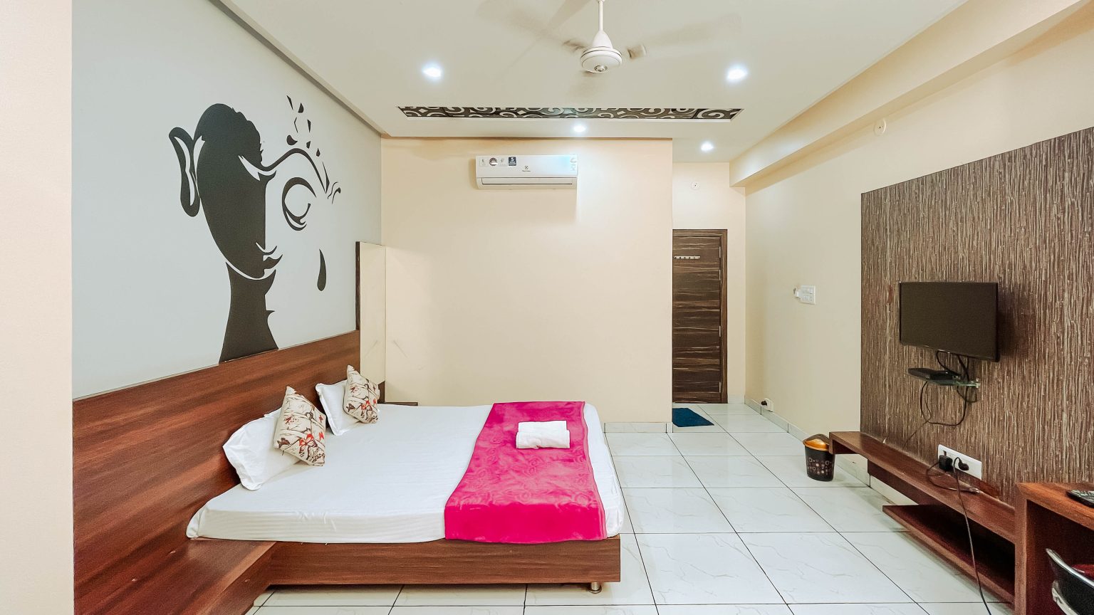 A premium deluxe room in Best hotel in ujjain - Nakshatra inn. Book now